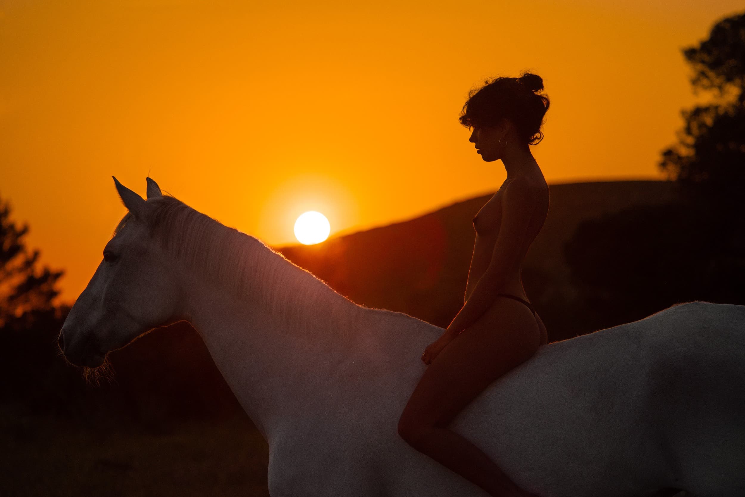 Editorial retouching for Kate Bellm, rider on a white horse at sunset